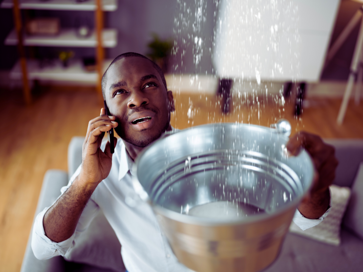 homeowner dealing with plumbing emergency