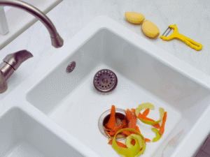 Food scraps going down continuous garbage disposal