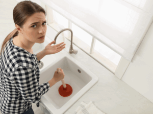 homeowner frustrated with her DIY method of clearing stubborn clog