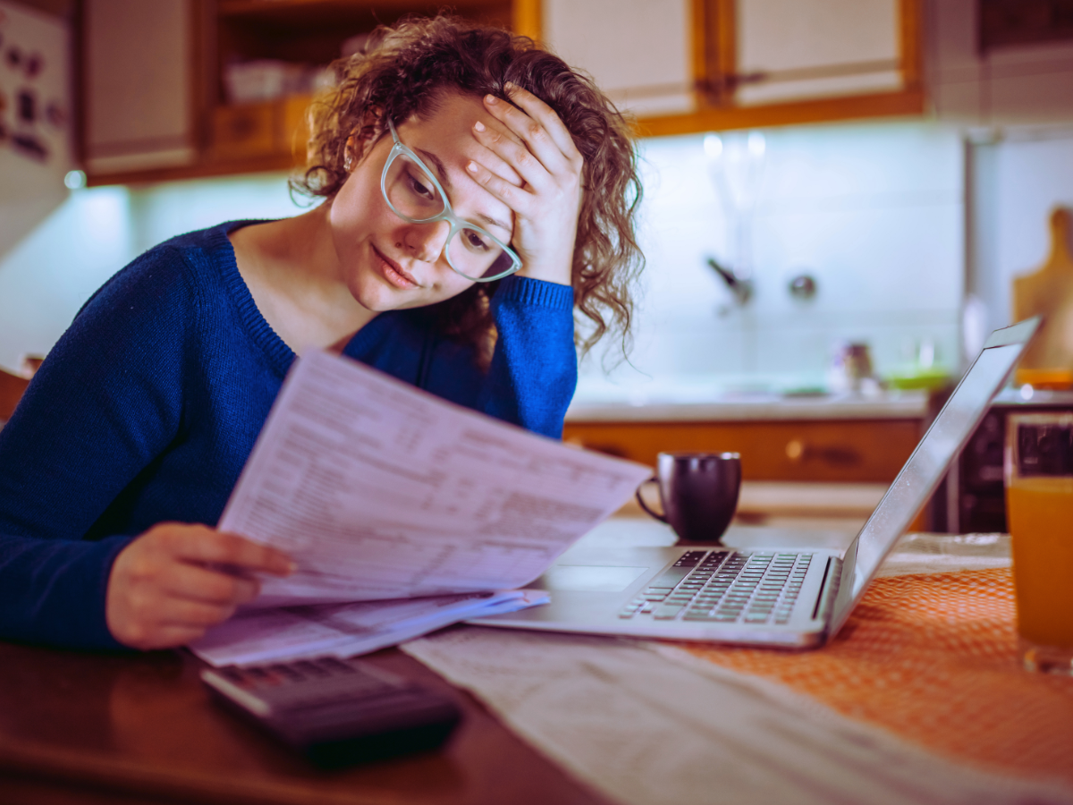 Home owner looking over high water bill 